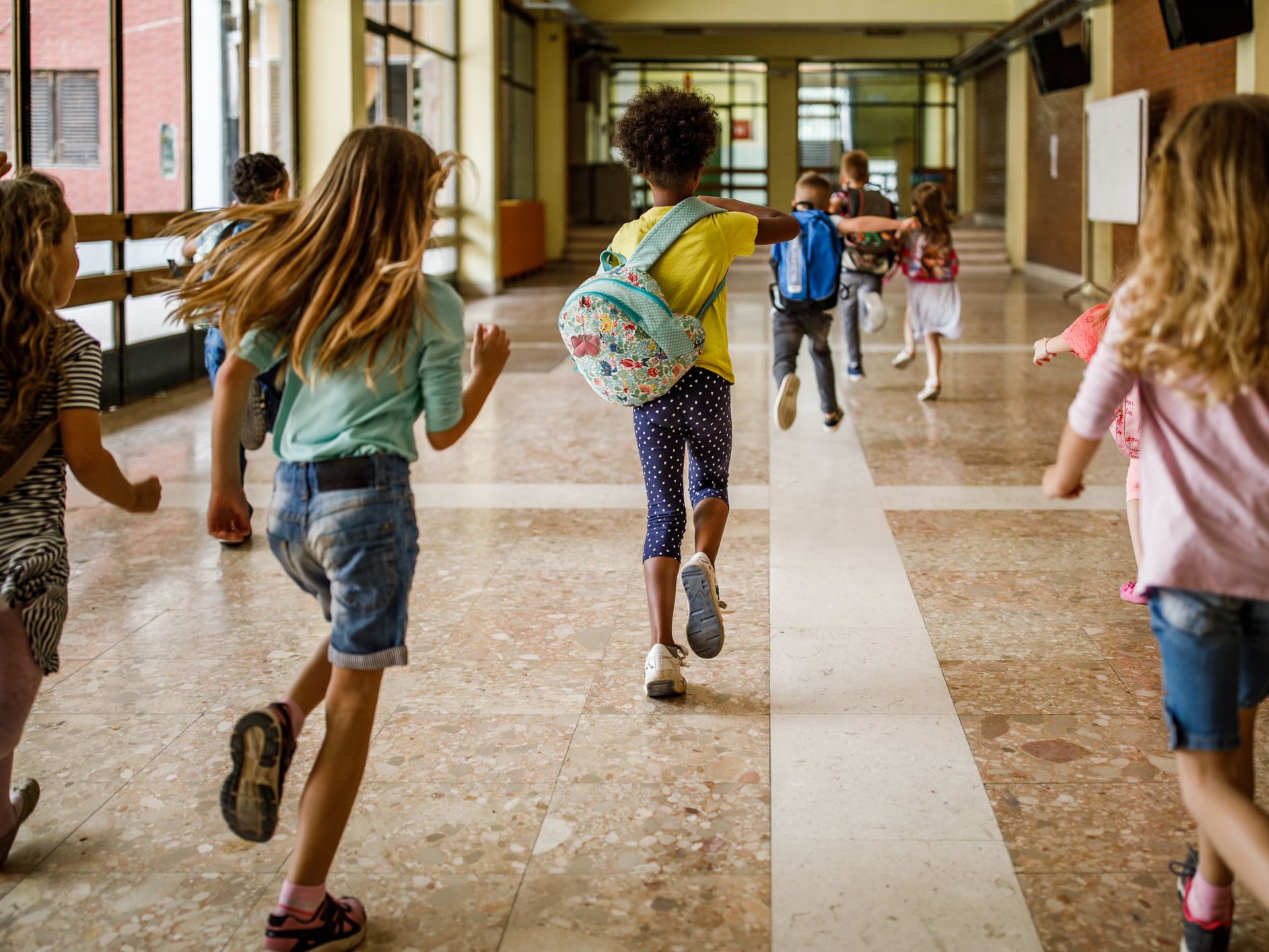 Children running down hallway